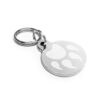 A white keychain with a paw print on it.